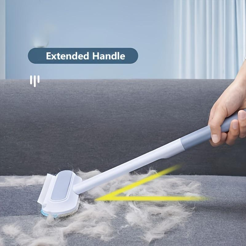 Cleaning brush with extended handle removing pet hair from a carpet, labeled 'Extended Handle'.